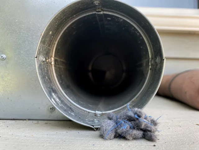 Weston Dryer Vent Cleaning technician using specialized equipment to clear severe dryer vent blockage in Weston